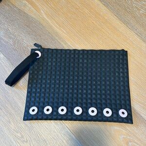 NO KO’OI wristlet clutch in black and pink